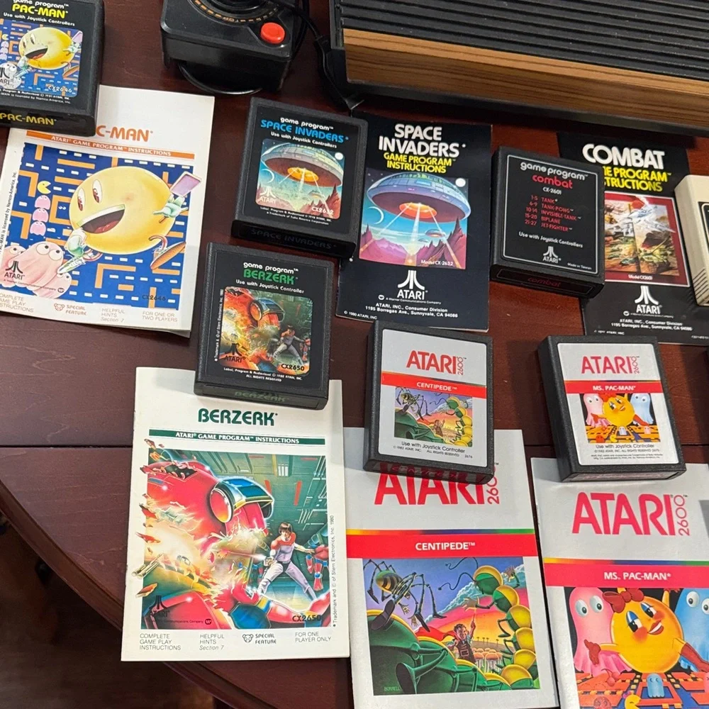 Vintage Authentic Atari 2600 with controllers, games and instruction booklets.